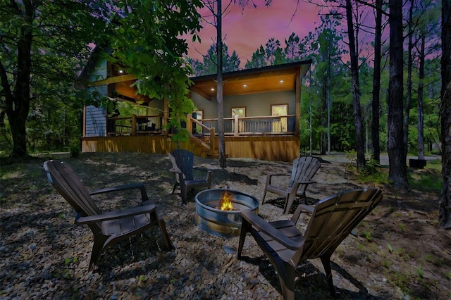 patio terrace at dusk with a fire pit