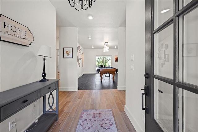 hallway with wood-type flooring