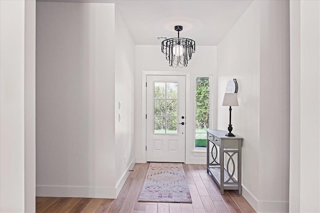 entryway featuring a notable chandelier