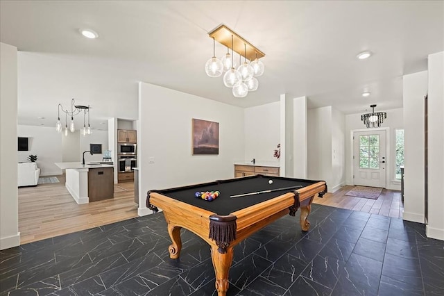 game room with dark hardwood / wood-style flooring, sink, and billiards