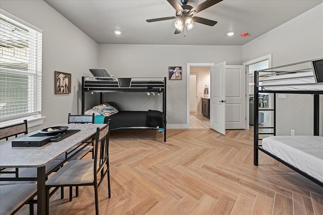 bedroom with ceiling fan and light parquet flooring