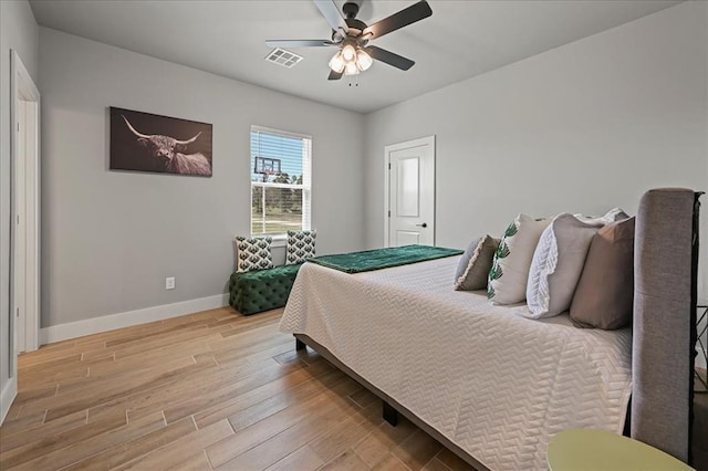 bedroom featuring ceiling fan and light hardwood / wood-style flooring