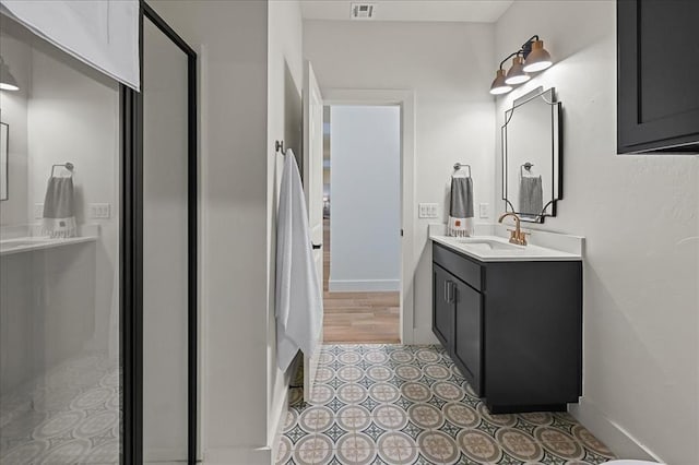 bathroom with vanity and tile patterned floors