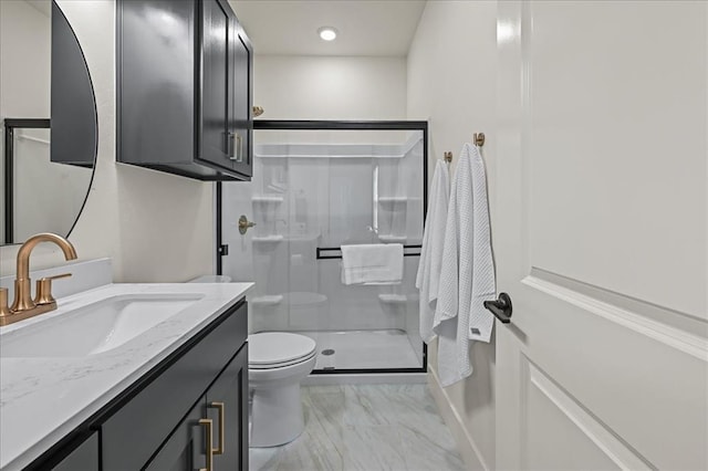 bathroom with vanity, toilet, and walk in shower