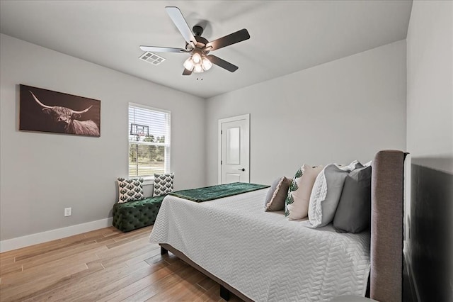 bedroom featuring light hardwood / wood-style flooring and ceiling fan