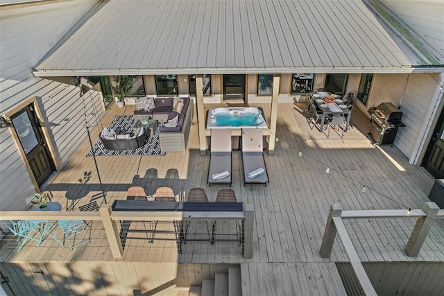 wooden terrace featuring an outdoor living space and grilling area