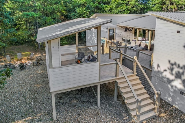 wooden deck featuring a fire pit