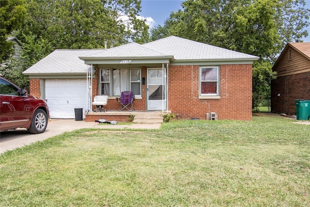 view of front facade with a front yard and a garage