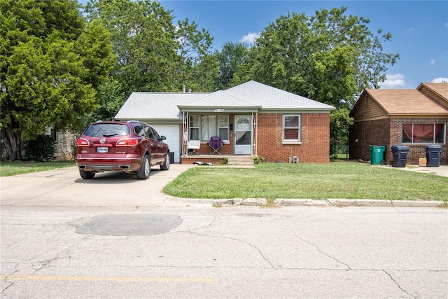 view of front of house with a front lawn, a porch, and a garage