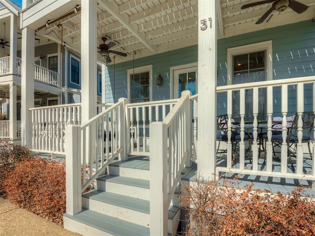 view of exterior entry featuring ceiling fan