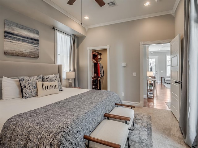 bedroom featuring ornamental molding, recessed lighting, visible vents, and a spacious closet