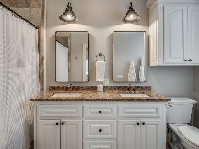 full bath featuring double vanity, a shower with shower curtain, a sink, and toilet