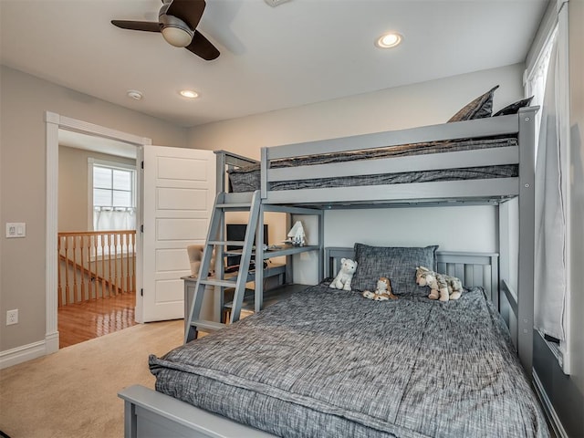 carpeted bedroom with ceiling fan and recessed lighting