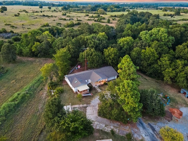 birds eye view of property with a rural view