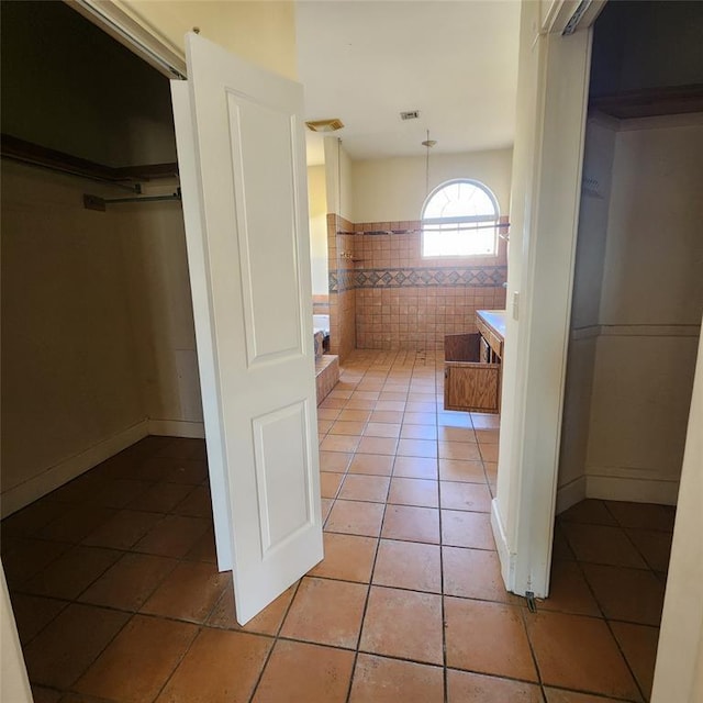 bathroom with tile patterned flooring