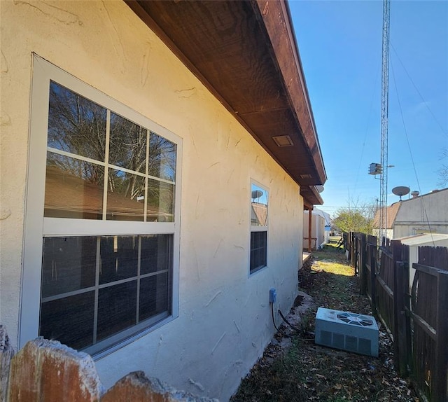 view of property exterior with cooling unit