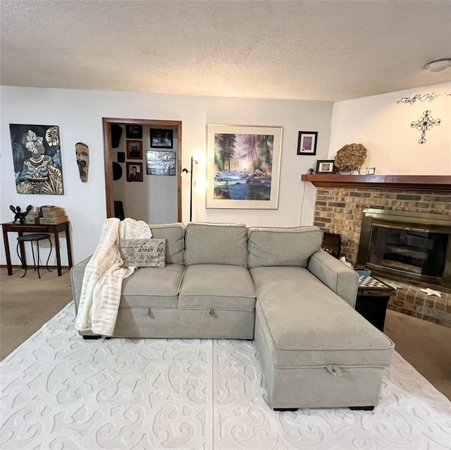 living room featuring carpet floors, a brick fireplace, and a textured ceiling