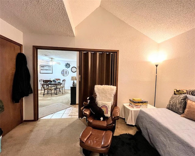 carpeted bedroom with lofted ceiling and a textured ceiling