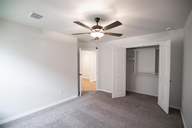 9237 NW 86th St, Yukon, OK 73099 - unfurnished bedroom featuring carpet floors, a closet, and a ceiling fan