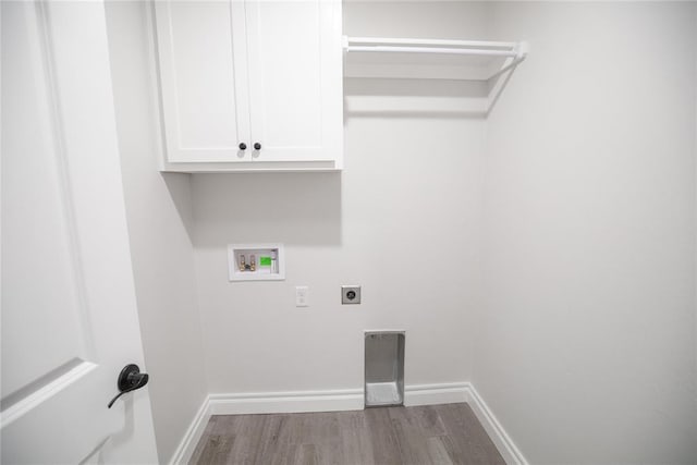 9237 NW 86th St, Yukon, OK 73099 - laundry room featuring wood finished floors, hookup for a washing machine, cabinet space, and hookup for an electric dryer