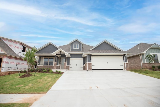9237 NW 86th St, Yukon, OK 73099 - craftsman-style house featuring a front lawn, an attached garage, concrete driveway, brick siding, and a shingled roof