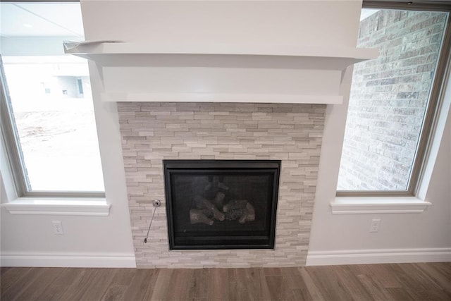 9237 NW 86th St, Yukon, OK 73099 - detailed view of wood finished floors and a glass covered fireplace