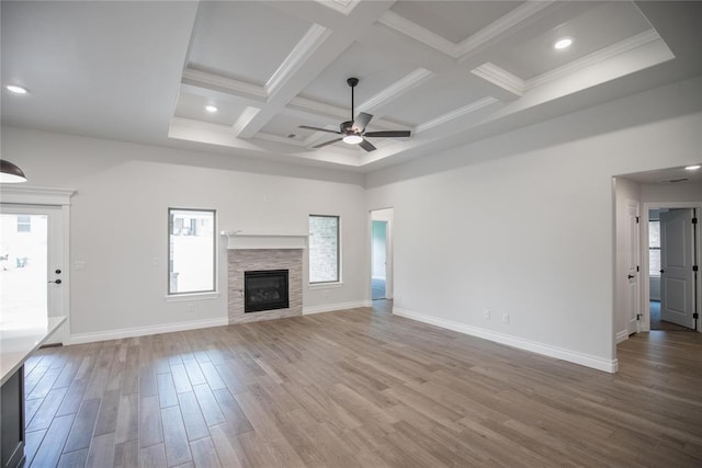 9237 NW 86th St, Yukon, OK 73099 - unfurnished living room with plenty of natural light, coffered ceiling, ceiling fan, wood finished floors, and beamed ceiling