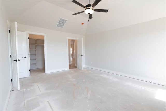 11813 Ethan Mark Dr, Yukon, OK 73099 - unfurnished bedroom with concrete flooring, baseboards, a spacious closet, a ceiling fan, and high vaulted ceiling