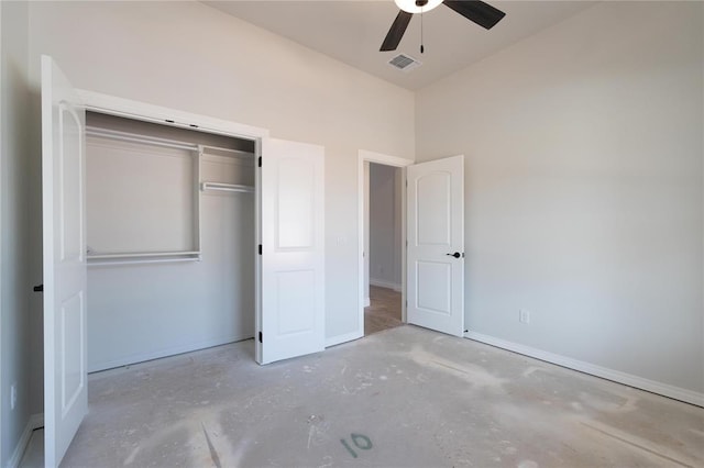 11813 Ethan Mark Dr, Yukon, OK 73099 - unfurnished bedroom with concrete floors, baseboards, a closet, ceiling fan, and vaulted ceiling