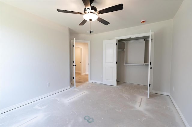 11813 Ethan Mark Dr, Yukon, OK 73099 - unfurnished bedroom with concrete floors, baseboards, a closet, and ceiling fan