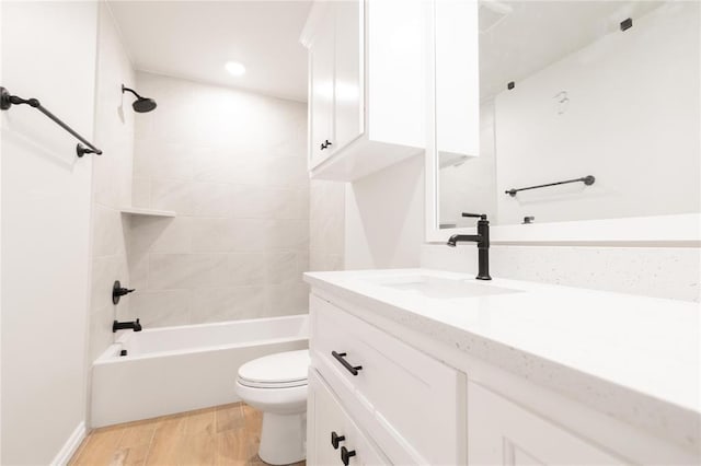 11813 Ethan Mark Dr, Yukon, OK 73099 - bathroom with vanity, toilet, wood finished floors, shower / bath combination, and recessed lighting
