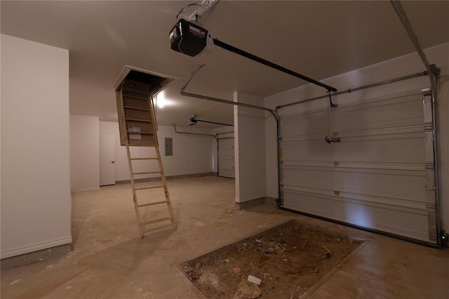 11813 Ethan Mark Dr, Yukon, OK 73099 - garage with a garage door opener, electric panel, and baseboards