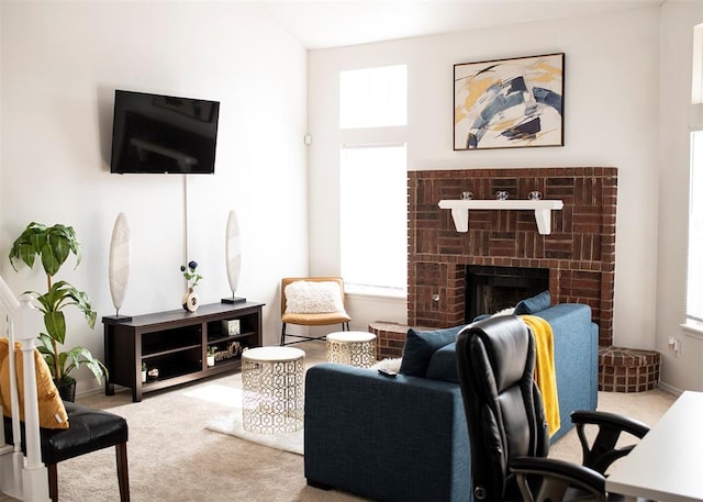 carpeted living room featuring a brick fireplace