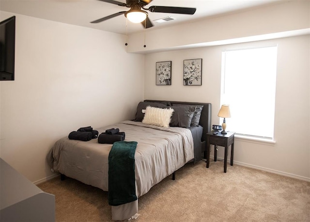 carpeted bedroom featuring ceiling fan