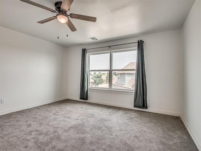 unfurnished room featuring carpet floors and ceiling fan