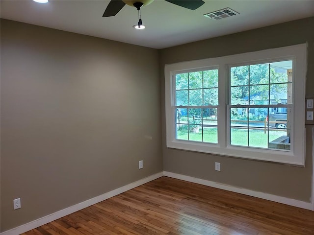 1021 W Apache St, Norman, OK 73069 - unfurnished room with baseboards, wood finished floors, ceiling fan, and recessed lighting