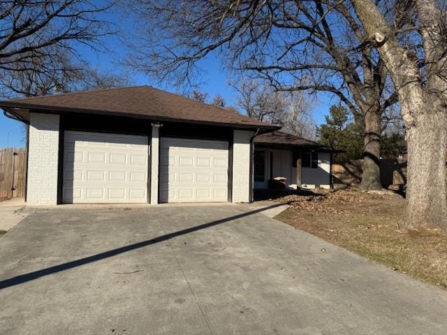 garage with concrete driveway