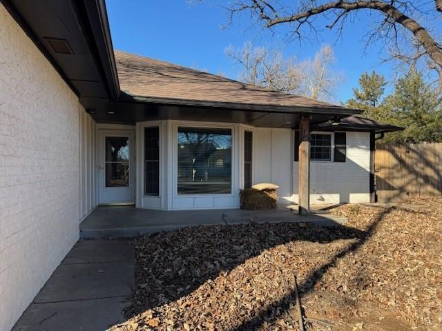 entrance to property with a patio area