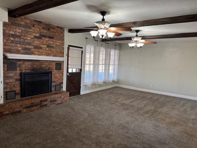 unfurnished living room with a brick fireplace, carpet, beam ceiling, and baseboards