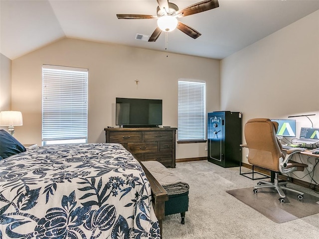 carpeted bedroom featuring multiple windows, ceiling fan, and lofted ceiling