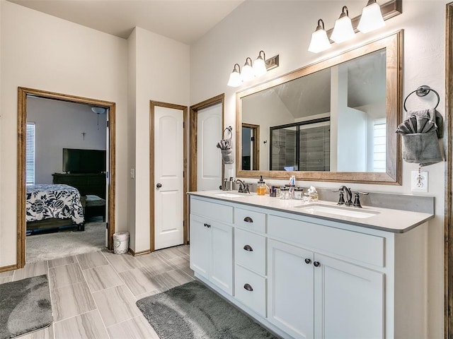 bathroom featuring vanity and a shower with shower door