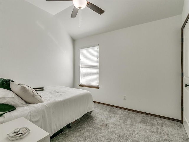 bedroom featuring ceiling fan and light colored carpet