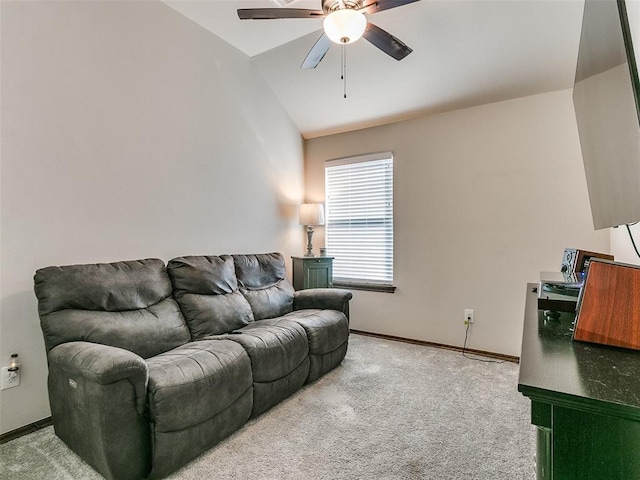 living room featuring carpet flooring, vaulted ceiling, and ceiling fan