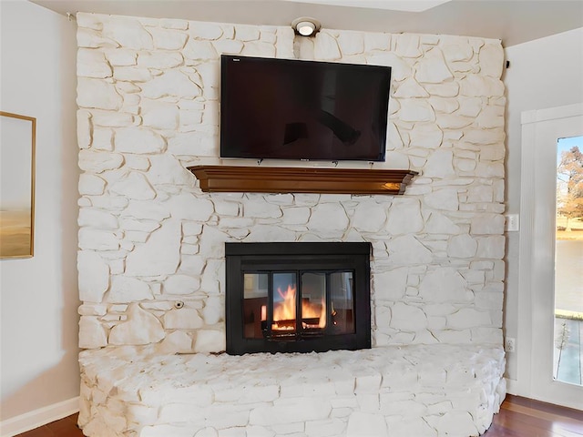 interior details with a fireplace and hardwood / wood-style floors