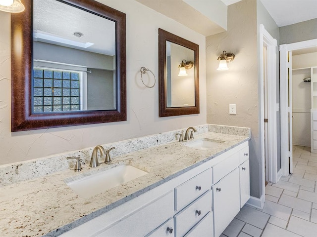 bathroom featuring vanity and tile patterned flooring