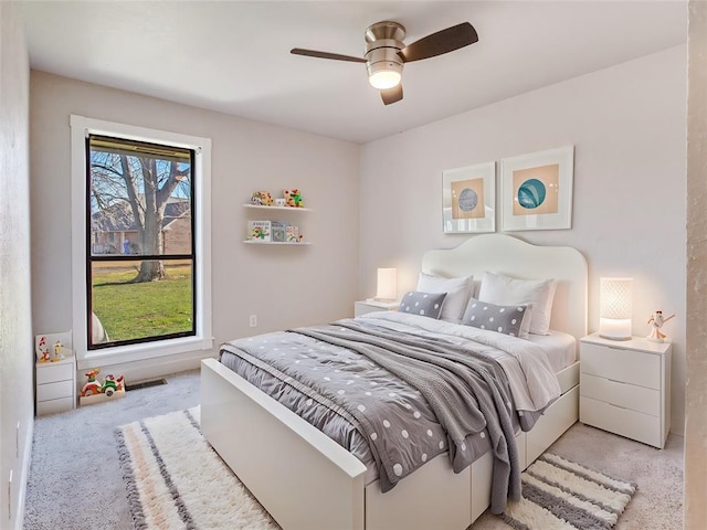 carpeted bedroom with ceiling fan