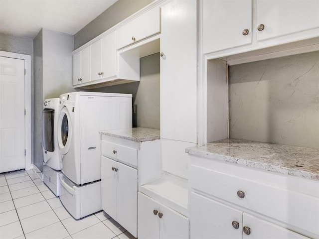 laundry room with light tile patterned floors and independent washer and dryer