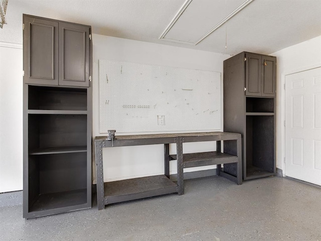 2207 Lake Front Cir, Norman, OK 73069 - miscellaneous room featuring attic access, a workshop area, and speckled floor