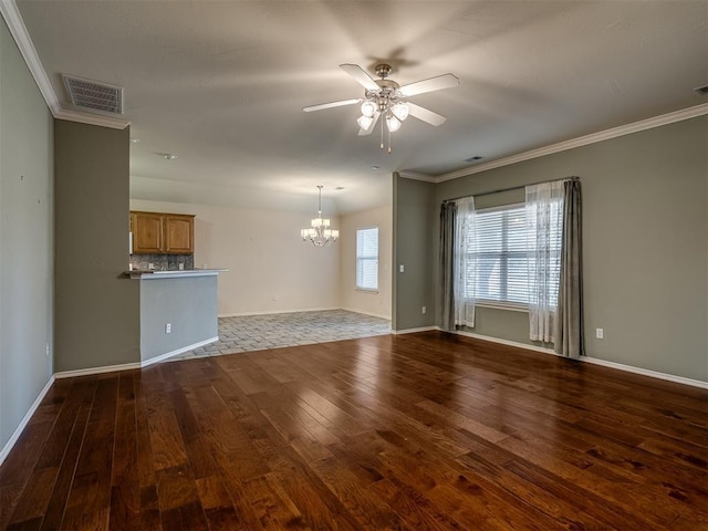 unfurnished living room featuring ornamental molding, ceiling fan with notable chandelier, and dark wood-type flooring