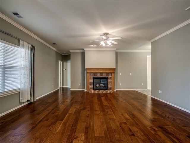 unfurnished living room with ceiling fan, dark hardwood / wood-style flooring, a fireplace, and crown molding